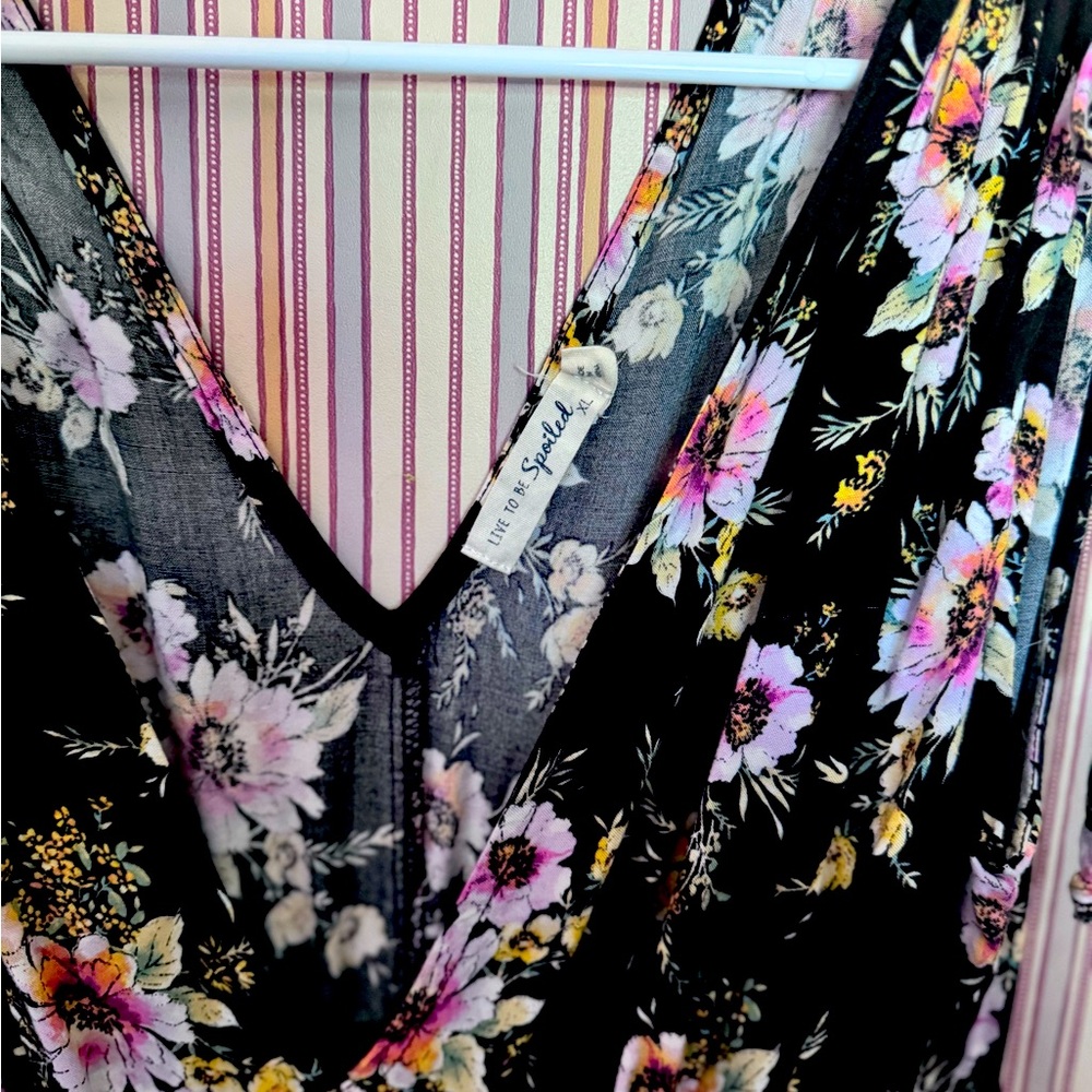 Black and floral dress with plunging neckline, and side slits. Date night dress!